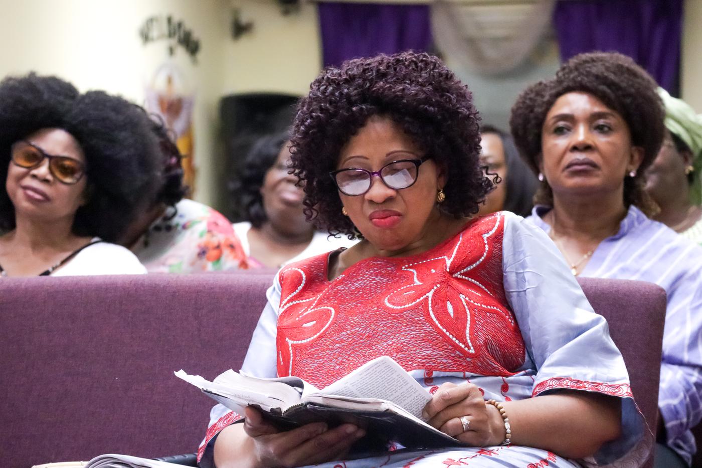 Women reading scripture in the pews